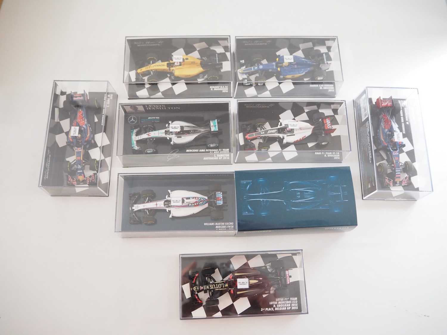 Lot 212 - A group of 1:43 scale Formula 1 race cars by...