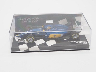 Lot 212 - A group of 1:43 scale Formula 1 race cars by...