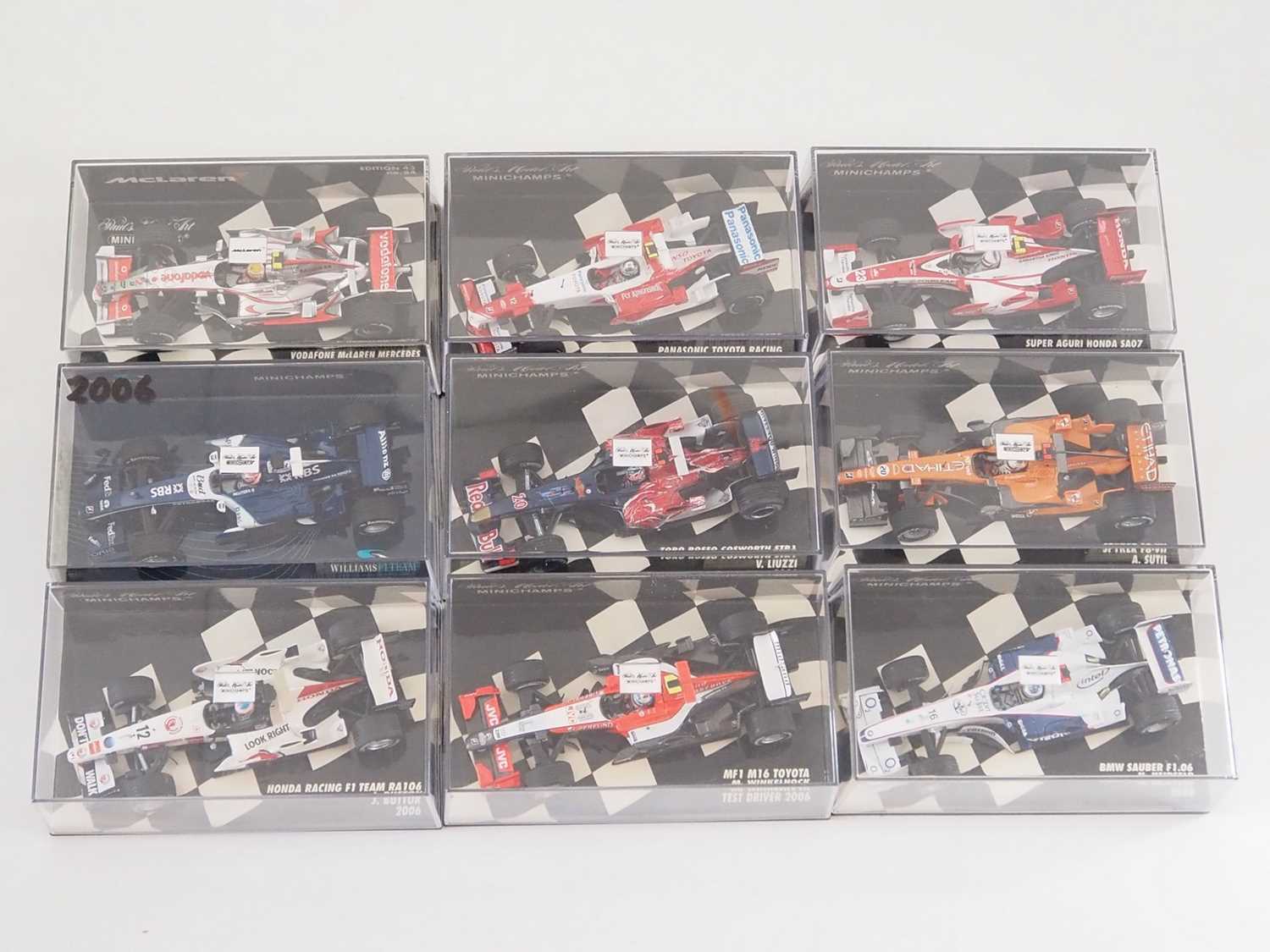 Lot 208 - A group of 1:43 scale Formula 1 race cars by...