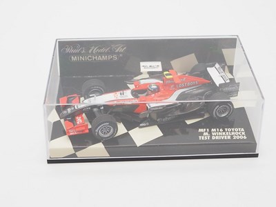 Lot 208 - A group of 1:43 scale Formula 1 race cars by...