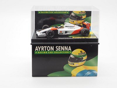 Lot 191 - A group of 1:43 scale Formula 1 race cars by...