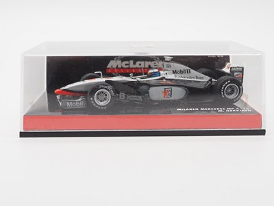 Lot 191 - A group of 1:43 scale Formula 1 race cars by...