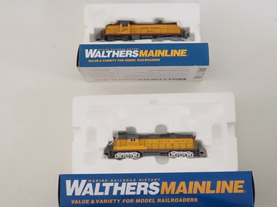 Lot 225 - A pair of WALTHERS MAINLINE HO gauge diesel...