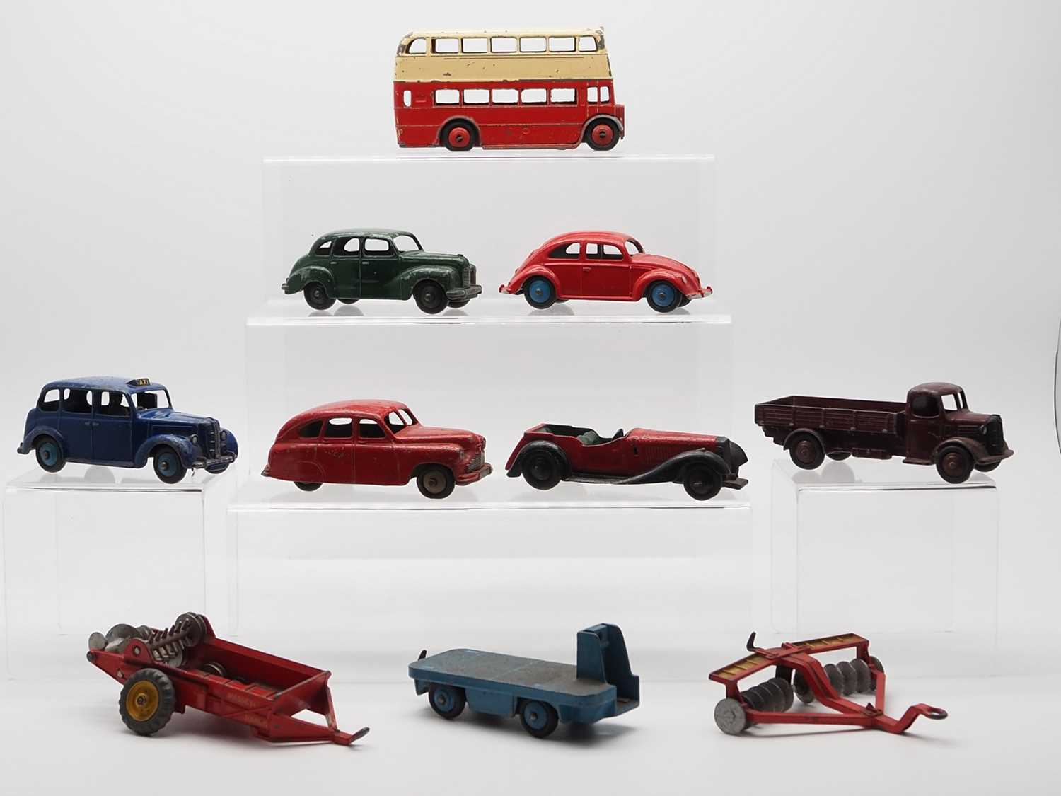 Lot 48 - A group of DINKY Toys to include: a 181 VW...