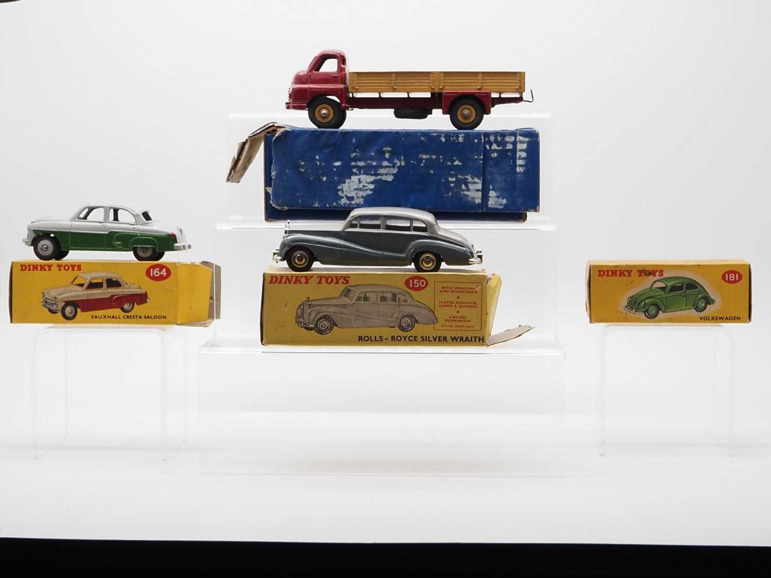 Lot 56 - A group of DINKY Toys plus an empty box,...