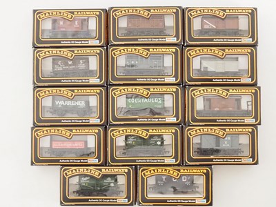 Lot 586 - A group of MAINLINE OO gauge mixed wagons in...