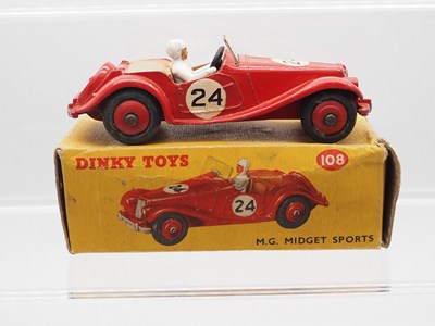 Lot 67 - A DINKY 108 M.G. Midget Sports car, red with...