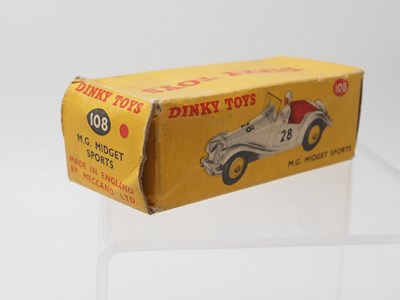 Lot 67 - A DINKY 108 M.G. Midget Sports car, red with...
