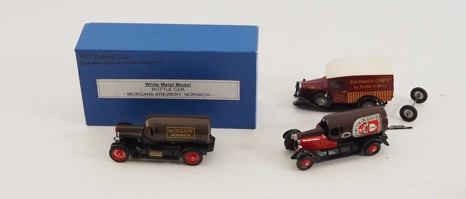 Lot 9 - A group of whitemetal delivery vans comprising...