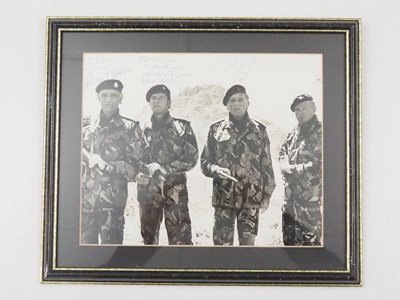 Lot 323 - A framed and glazed 10" x 8" black/white still...