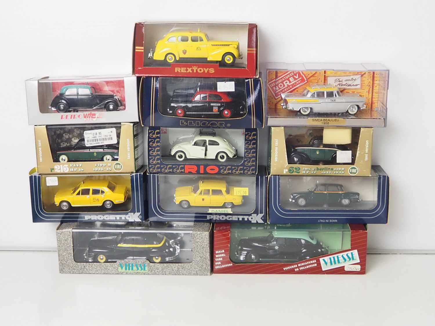 Lot 8 - A group of 1:43 scale models of taxis, to...