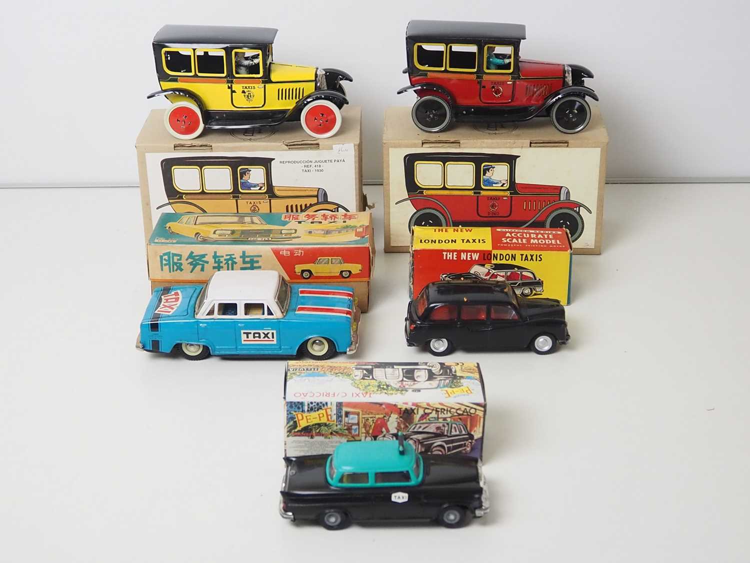 Lot 9 - A group of plastic and tin plate models of...