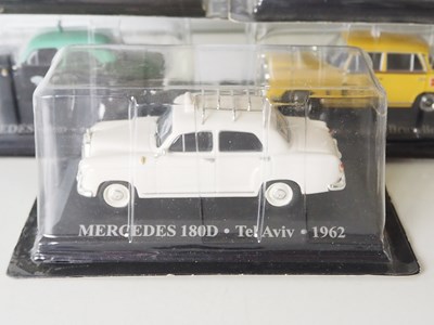 Lot 56 - A group of diecast 1:43 scale model Taxis by...