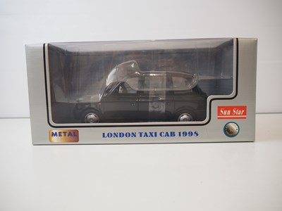 Lot 126 - A pair of diecast taxis - comprising of a...