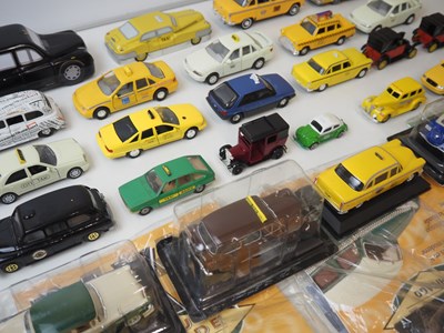 Lot 158 - A large mixed group of diecast Taxis to...