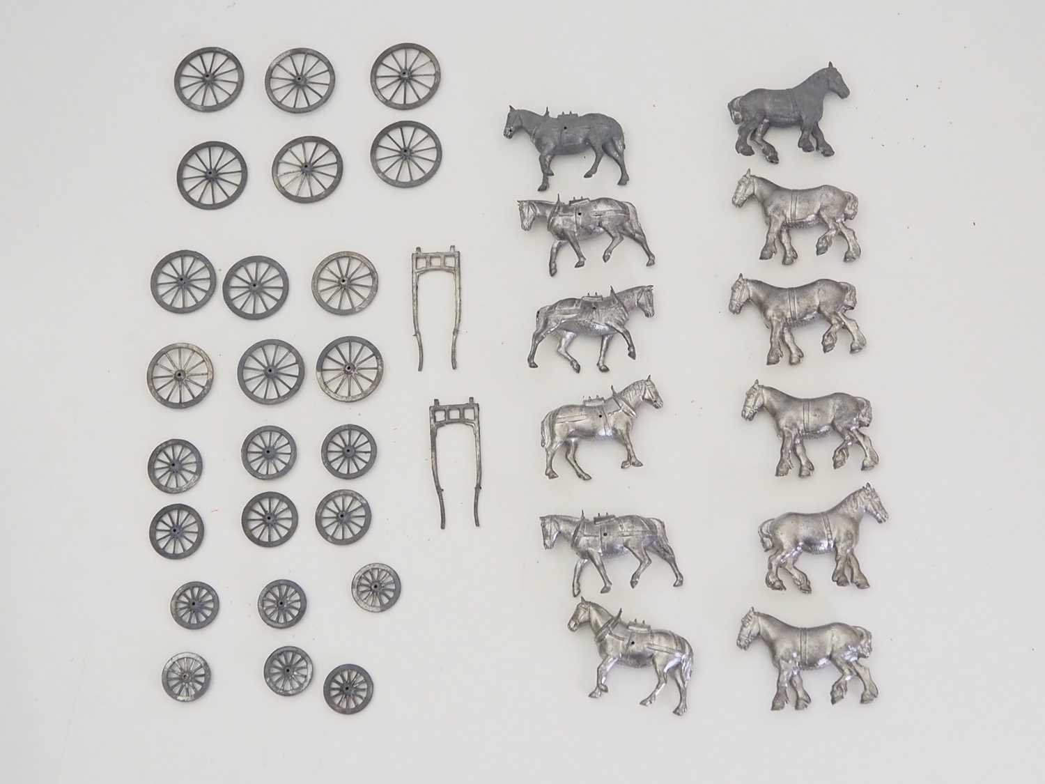 Lot 197 - A group of unpainted BRITAINS lead cart horses...