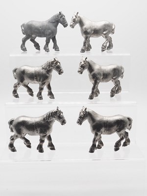 Lot 197 - A group of unpainted BRITAINS lead cart horses...