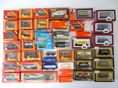 Lot 603 - A quantity of OO Gauge freight wagons by...