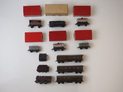 Lot 485 - A quantity of TRIX TWIN HO/OO gauge rolling...