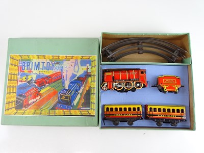 Lot 104 - A BRIMTOY O gauge clockwork tinplate train set...