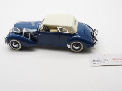 Lot 32 - A group of 1:24 and 1:18 scale diecast cars,...