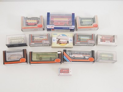 Lot 34 - A group of diecast buses and a tram in various...