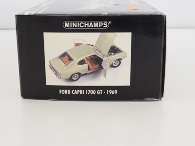Lot 37 - A pair of 1:18 scale diecast cars, comprising...