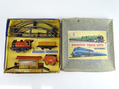 Lot 106 - A BRIMTOY O gauge clockwork tinplate train set...