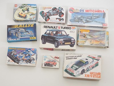 Lot 120 - A group of mixed car and plane kits by TAMIYA,...