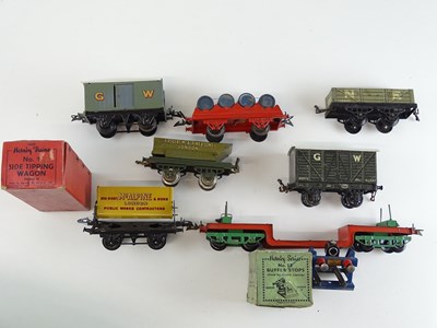 Lot 107 - A group of HORNBY SERIES O gauge wagons and an...