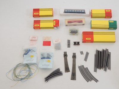 Lot 211 - A group of boxed and unboxed MINITRIX track...