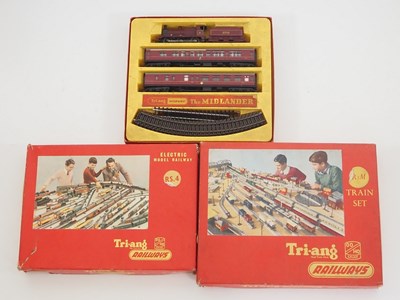 Lot 380 - A group of three TRI-ANG OO Gauge train sets,...