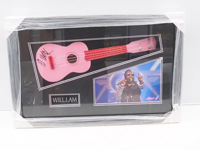 Lot 687 - WILL.I.AM - signed Ukelele framed and glazed...