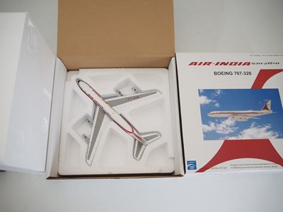 Lot 15 - A pair of diecast model airplanes comprising a...