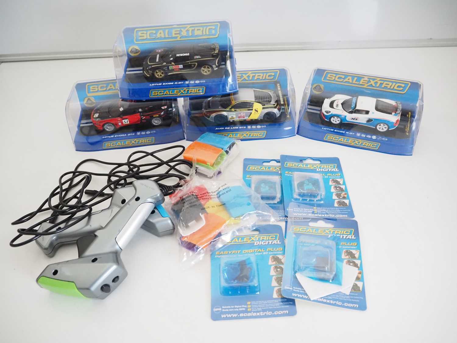 Lot 196 - A selection of SCALEXTRIC cars, controllers...