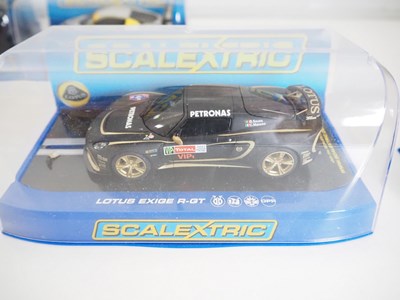 Lot 196 - A selection of SCALEXTRIC cars, controllers...