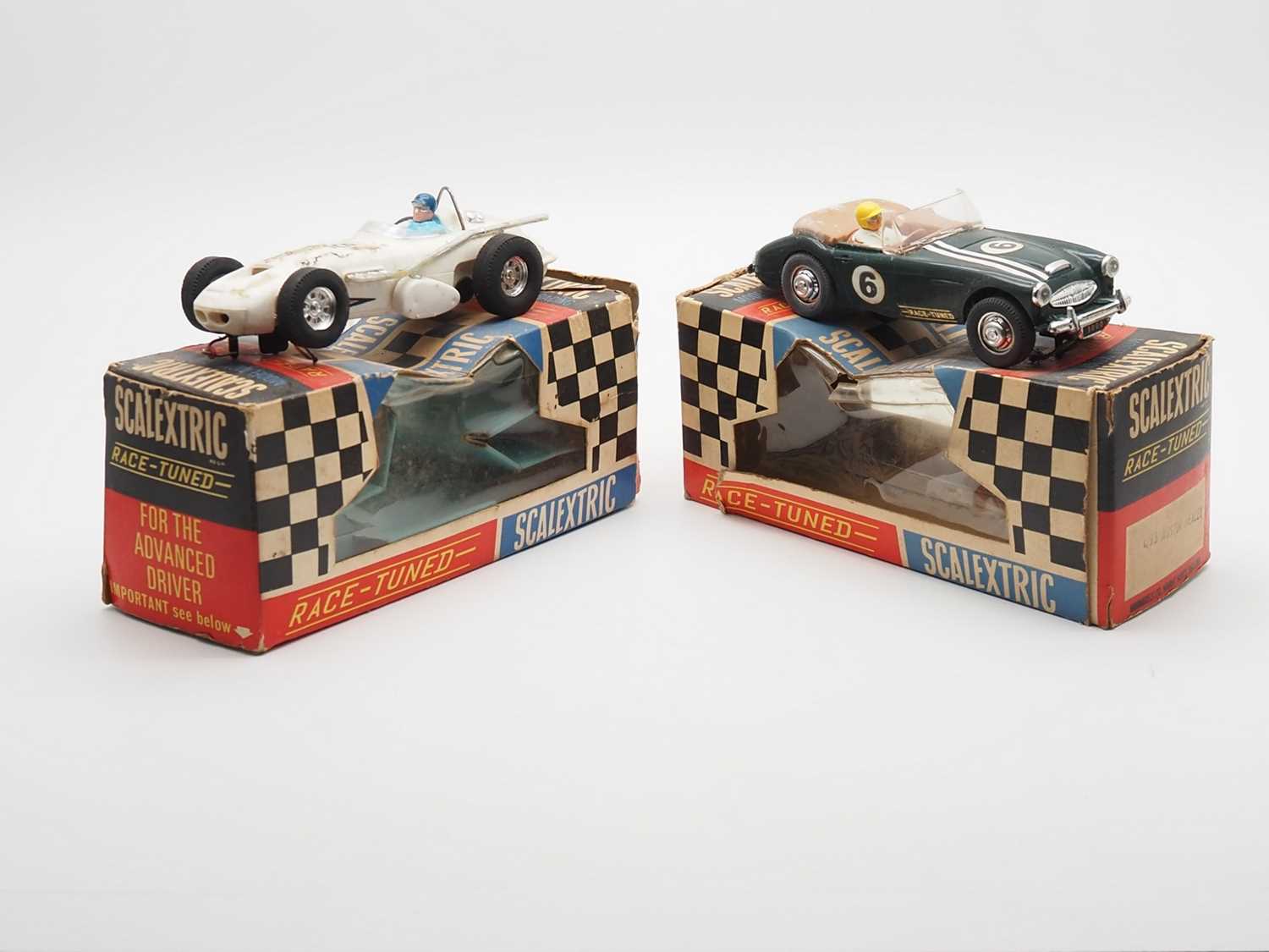 Lot 198 - A pair of vintage 1960a SCALEXTRIC racing cars...