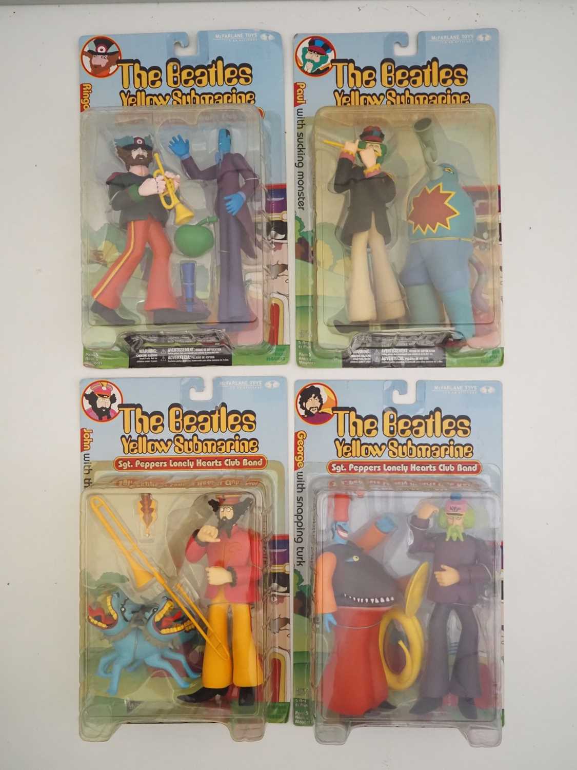 Lot 215 - A complete set of four MCFARLANE 'The Beatles -...