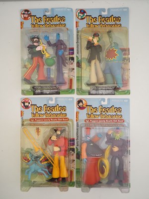 Lot 215 - A complete set of four MCFARLANE 'The Beatles -...