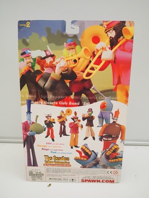 Lot 215 - A complete set of four MCFARLANE 'The Beatles -...