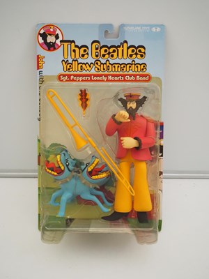 Lot 215 - A complete set of four MCFARLANE 'The Beatles -...