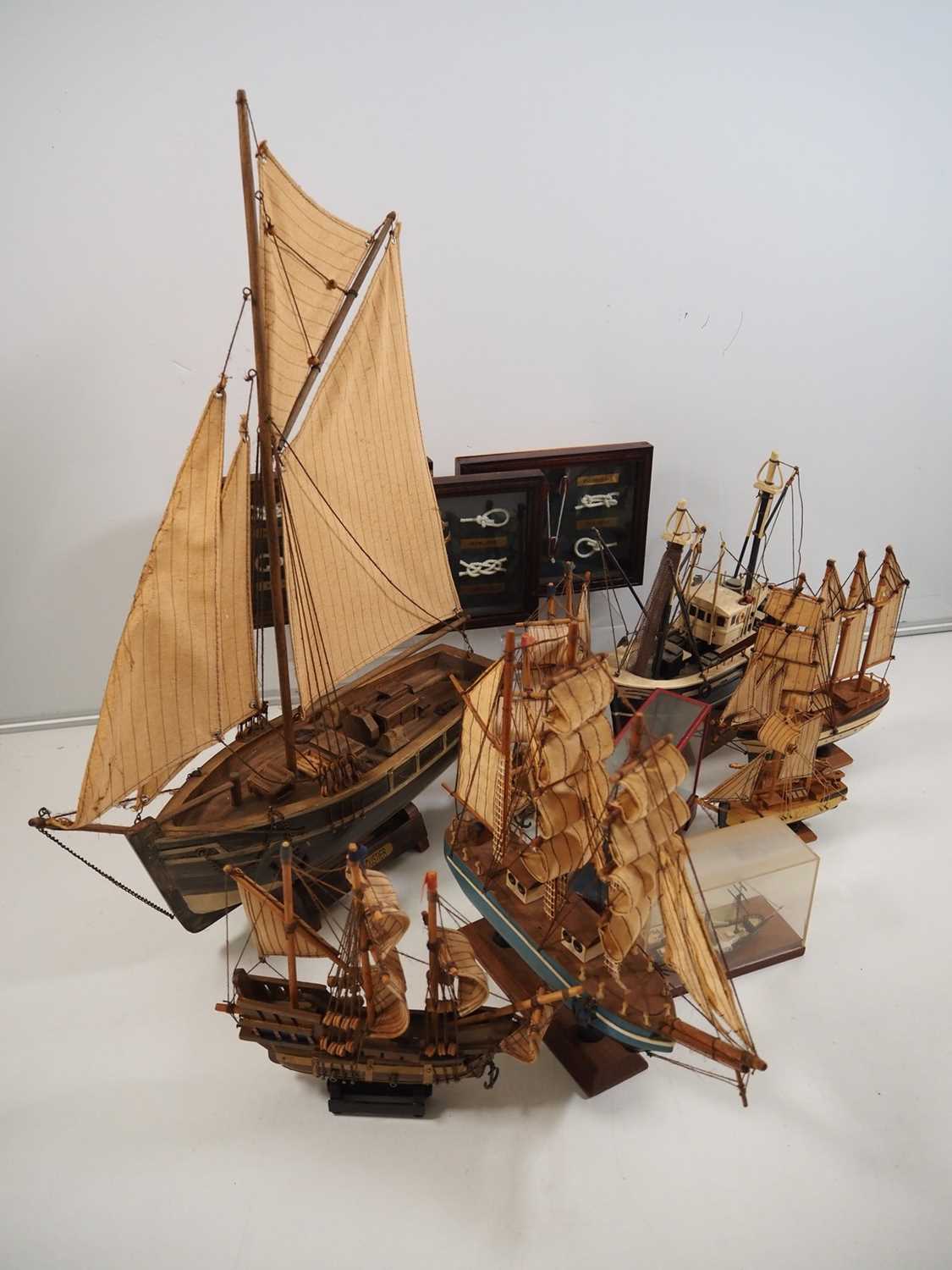 Lot 218 - A small flotilla of model ships together with...