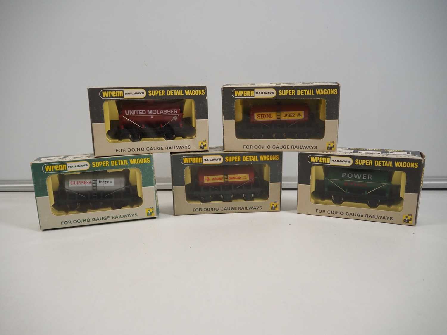 Lot 572 - A group of five WRENN OO gauge tank wagons...