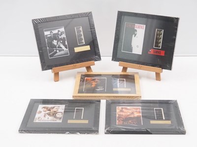Lot 26 - A group of framed film cels comprising: TROY,...