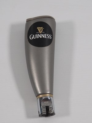 Lot 391 - A group of 3 Guinness beer pump covers, Two of...