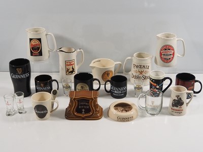 Lot 412 - A collection of Guinness mugs, water jugs,...