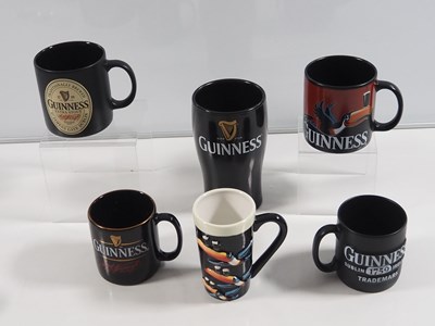 Lot 412 - A collection of Guinness mugs, water jugs,...