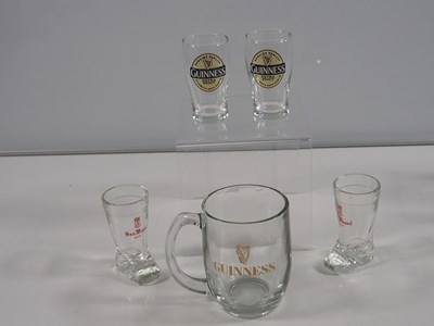 Lot 412 - A collection of Guinness mugs, water jugs,...