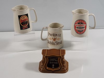 Lot 412 - A collection of Guinness mugs, water jugs,...