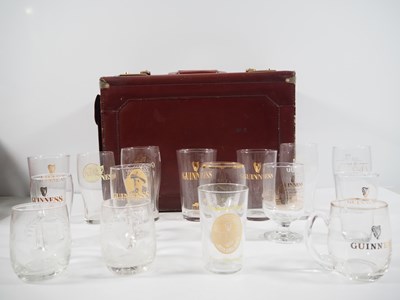 Lot 409 - A group of 16 Guinness drinking glasses of...